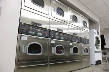 Dedicated laundry facilities w/high efficiency equipment & onsite dry cleaning